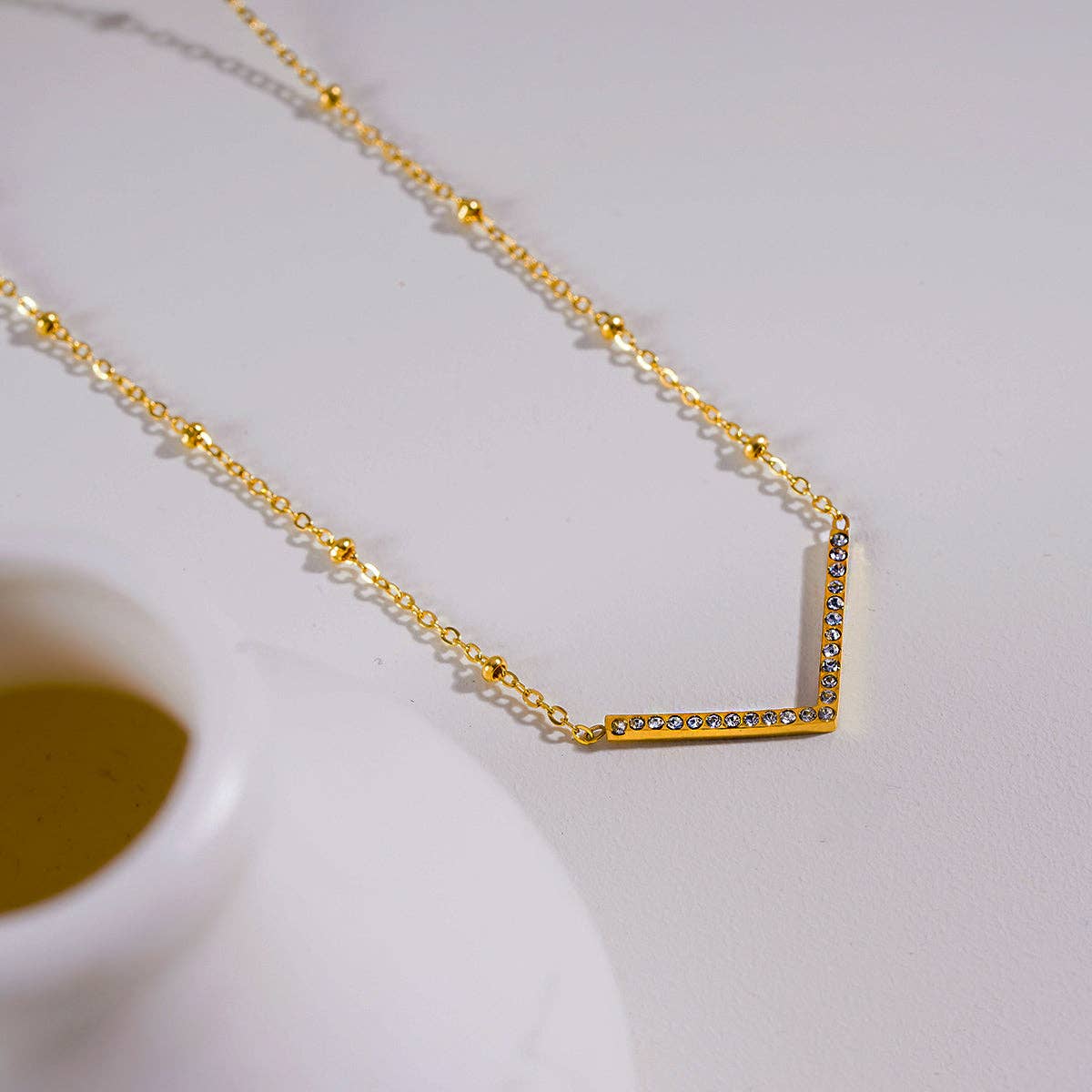Beaded Dainty Chain Anchoring 'V' Shaped Zirconia Embedded Pendant Charm Necklace