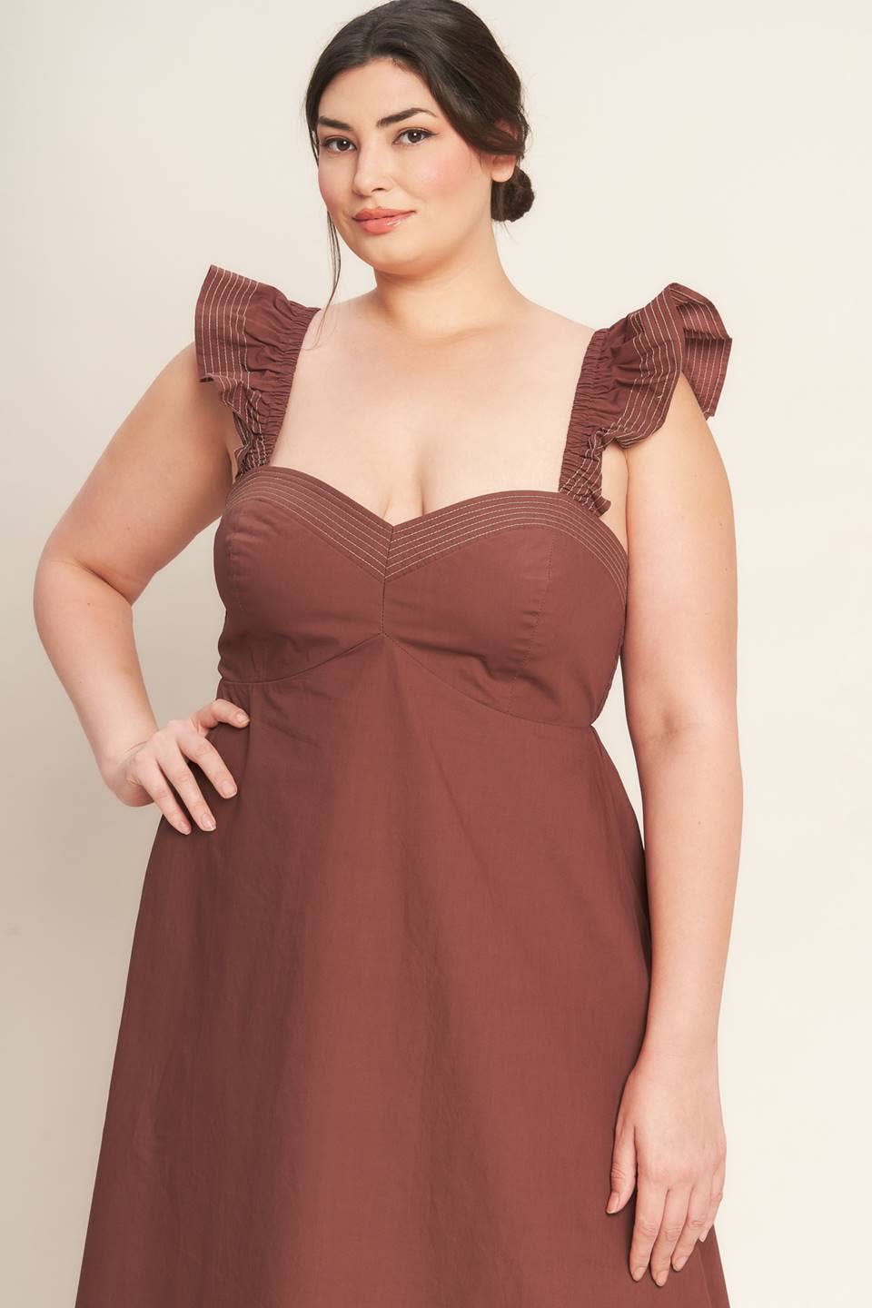 A solid woven midi dress